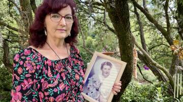 Lorraine Doyle with a photograph of her late mother, Lola Hope Dickson.