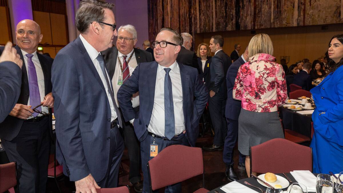 Qantas chief executive Alan Joyce speaking with Treasury secretary Steven Kennedy at Treasurer Jim Chalmers' post-budget address at Parliament House in May. Picture by Gary Ramage